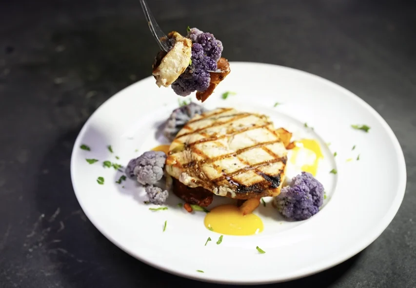 Atlantic Swordfish with smashed potatoes, purple cauliflower and a tangerine burre blanc